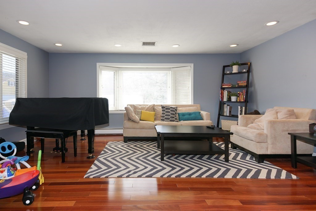 39 Locust Street Burlington, MA 01803 - Photo 14 of 27 a living room with furniture and a window