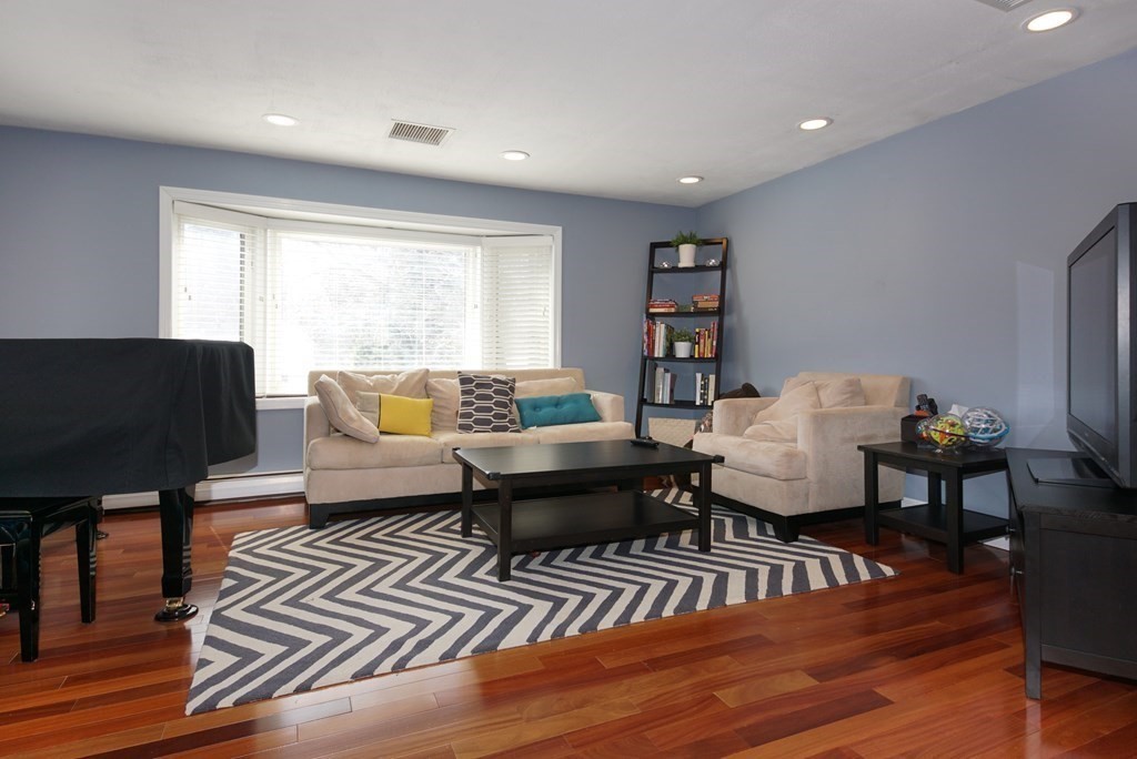 39 Locust Street Burlington, MA 01803 - Photo 15 of 27 a living room with furniture and a wooden floor