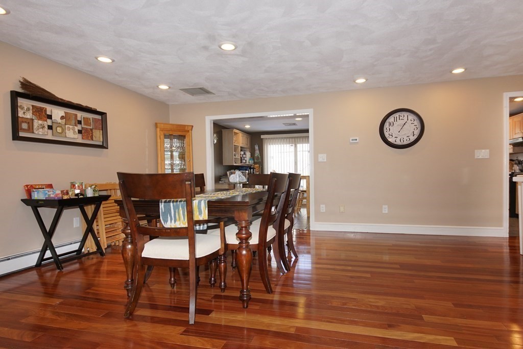 39 Locust Street Burlington, MA 01803 - Photo 16 of 27 a view of a dining room with furniture and wooden floor