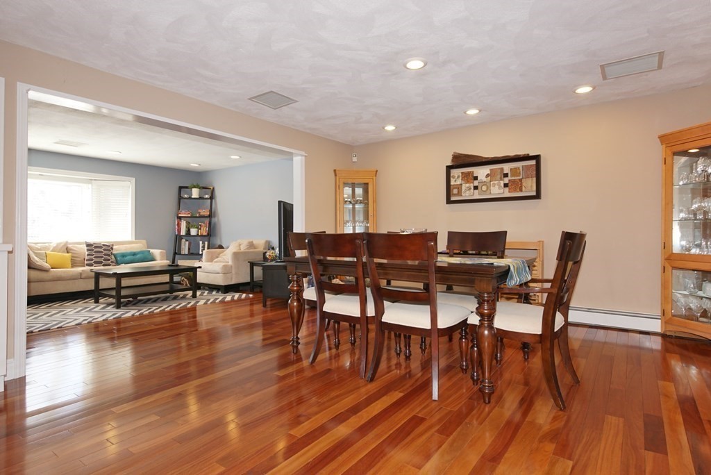39 Locust Street Burlington, MA 01803 - Photo 17 of 27 a view of a dining room with furniture and wooden floor