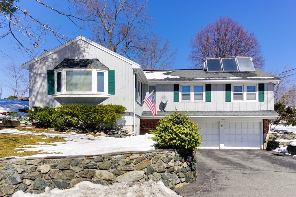 39 Locust Street Burlington, MA 01803 - Photo 2 of 27 a front view of a house with a yard