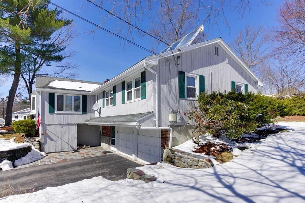 39 Locust Street Burlington, MA 01803 - Photo 22 of 27 a front view of a house with garden