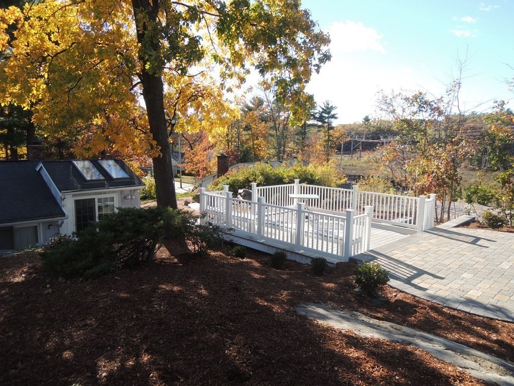 39 Locust Street Burlington, MA 01803 - Photo 27 of 27 a view of a house with a tree in the background