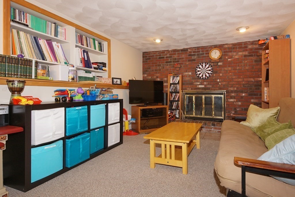 39 Locust Street Burlington, MA 01803 - Photo 7 of 27 a view of a living room with furniture and a flat screen tv