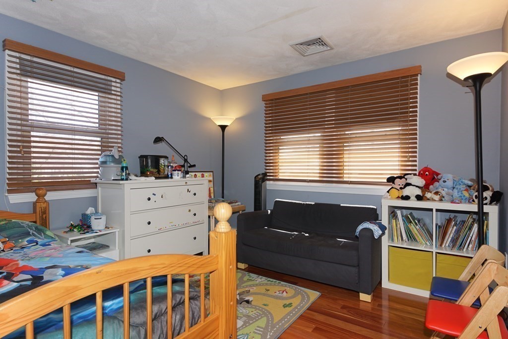 39 Locust Street Burlington, MA 01803 - Photo 10 of 27 a bedroom with a bed and a window