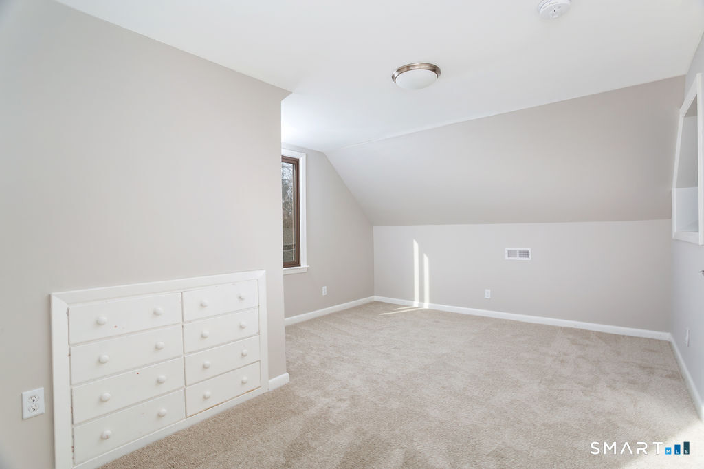 245 Reid Street Fairfield, CT 06824 - Photo 22 of 33 a view of an empty walk in closet