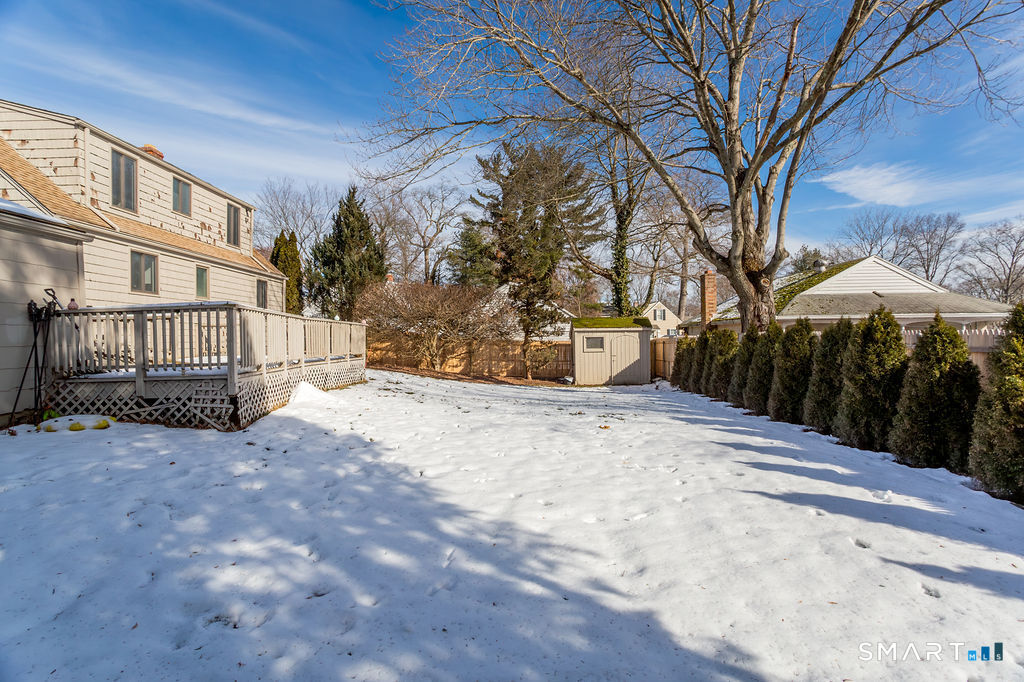245 Reid Street Fairfield, CT 06824 - Photo 29 of 33 a view of a building with a yard