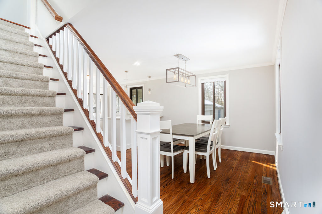 245 Reid Street Fairfield, CT 06824 - Photo 7 of 33 a view of entryway and hall with wooden floor