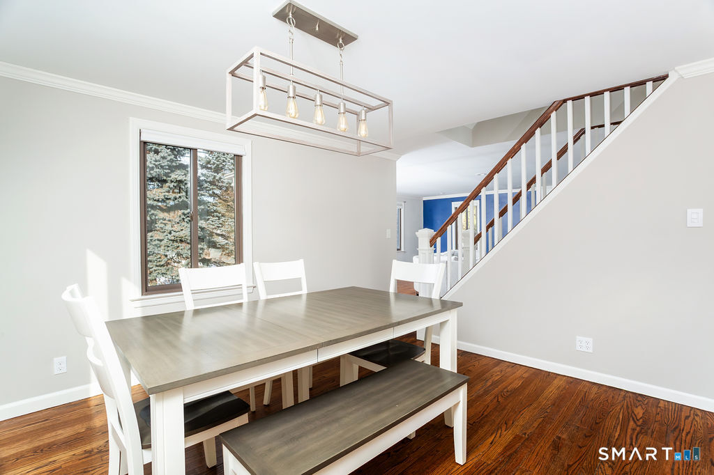 245 Reid Street Fairfield, CT 06824 - Photo 9 of 33 a view of entryway and hall with wooden floor