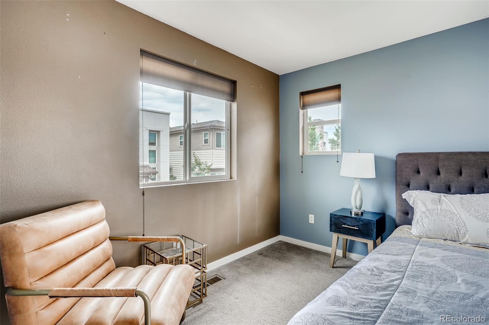 9817 Dunning Circle Highlands Ranch, CO 80126 - Photo 16 of 28 a bedroom with a bed and window