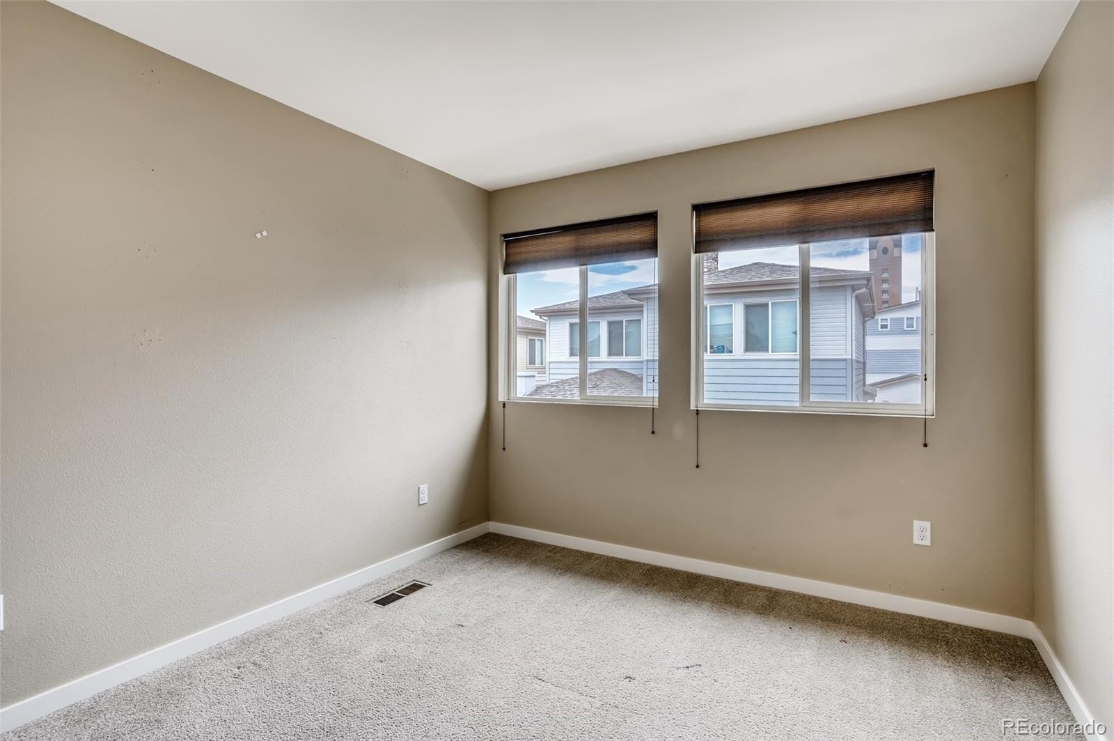 9817 Dunning Circle Highlands Ranch, CO 80126 - Photo 20 of 28 wooden floor and window in an empty room