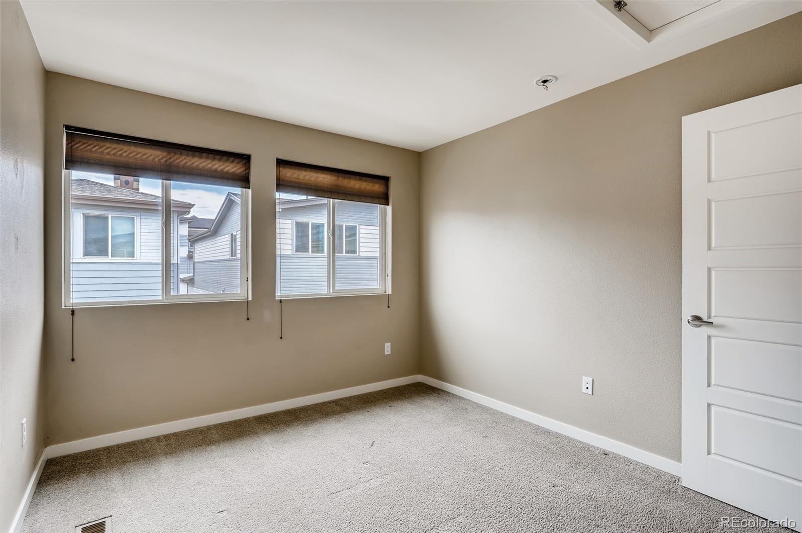 9817 Dunning Circle Highlands Ranch, CO 80126 - Photo 21 of 28 a view of an empty room with a window