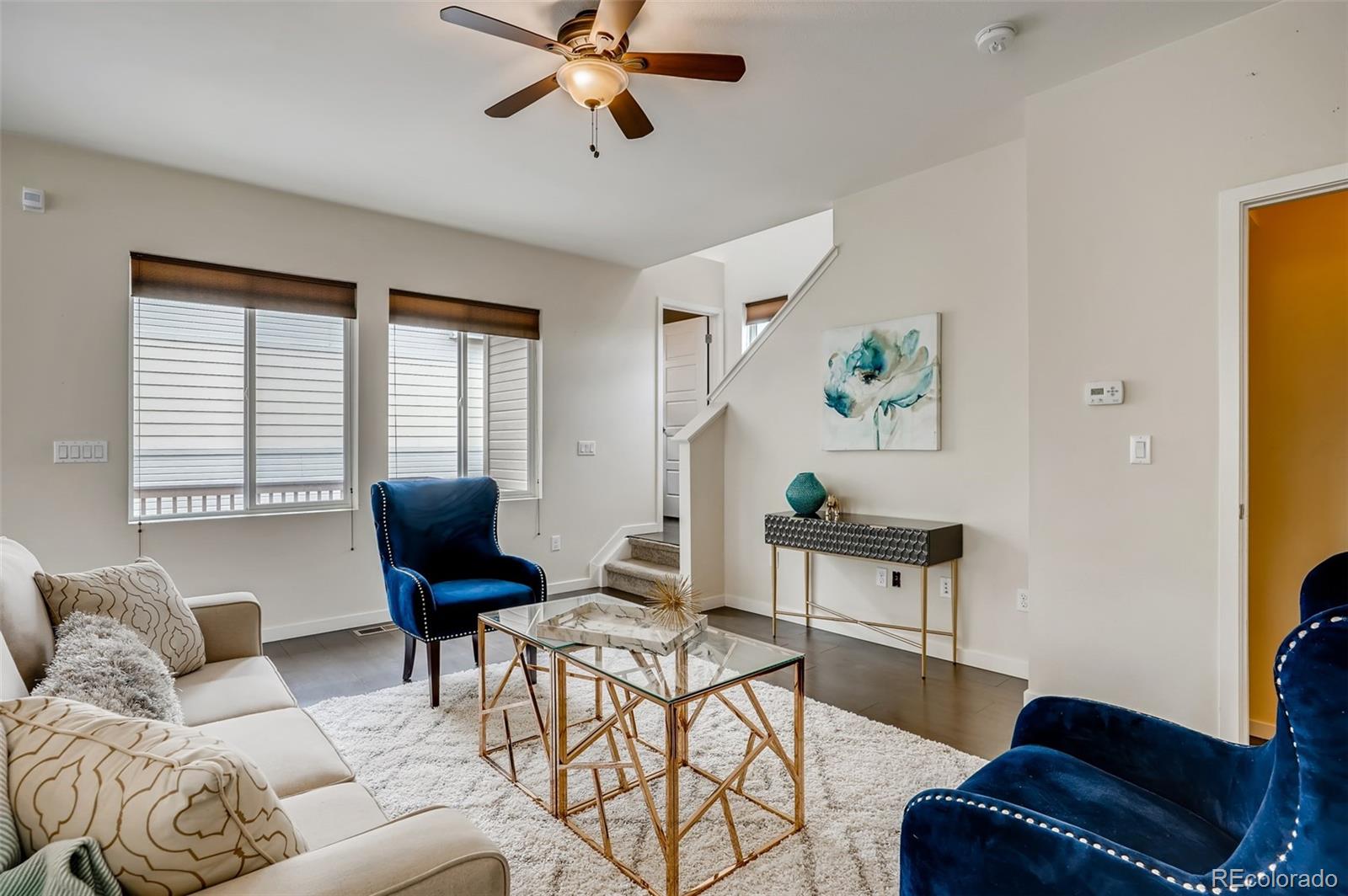 9817 Dunning Circle Highlands Ranch, CO 80126 - Photo 6 of 28 a living room with furniture and a window