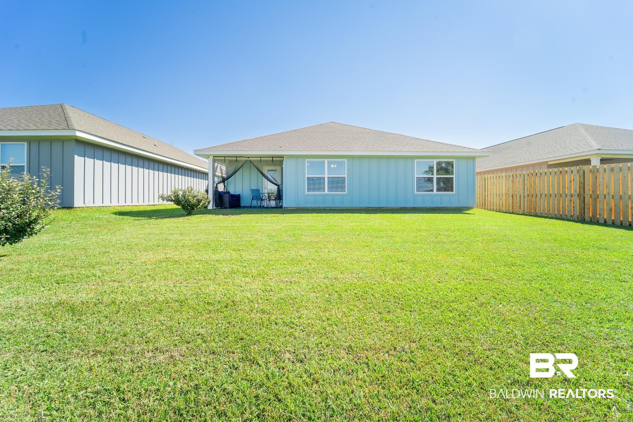 7449 Brompton Drive Foley, AL 36535 - Photo 26 of 27 Back of house with a yard