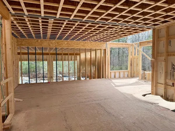 a view of an empty room with a balcony