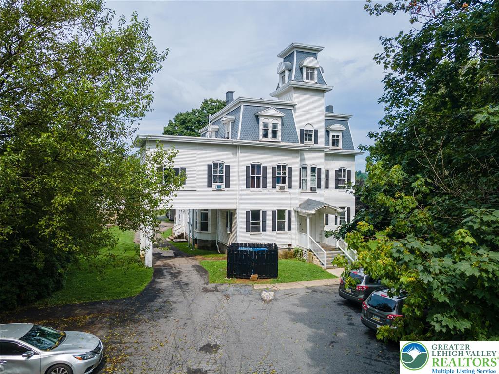 228 North 14th Street Easton, PA 18042 - Photo 3 of 12 a front view of a house with a yard and potted plants