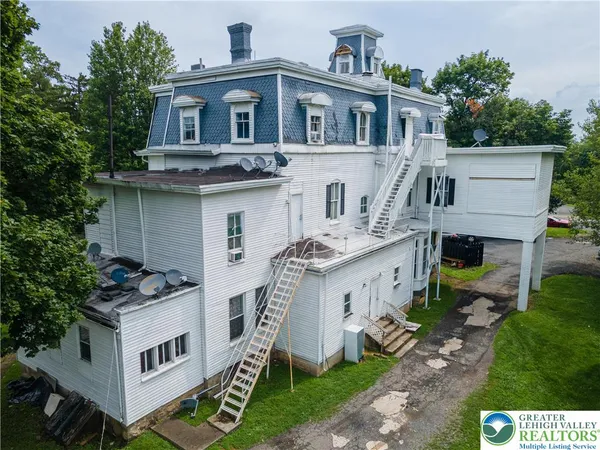 a aerial view of a house with a yard