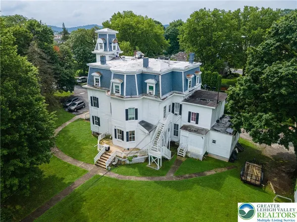 a aerial view of a house with a yard patio and slide
