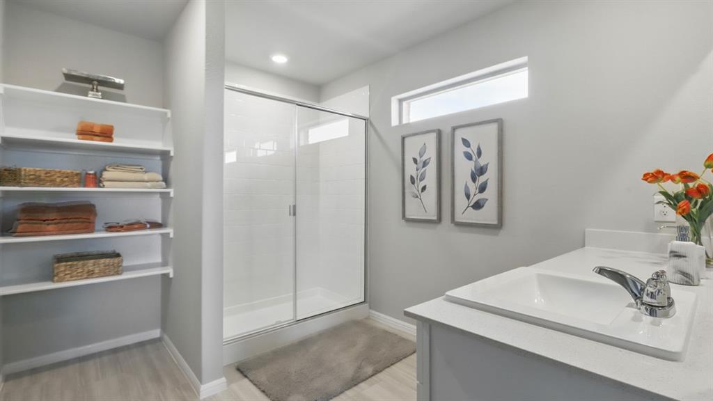 445 Blanco Drive Azle, TX 76020 - Photo 22 of 35 a bathroom with a sink and a mirror