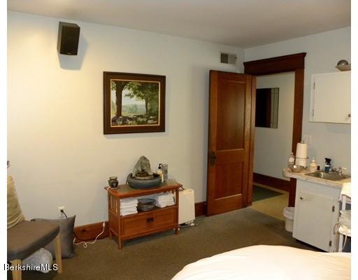 335 Federal Street Greenfield, MA 01301 - Photo 11 of 30 a bedroom with a bed and a mirror