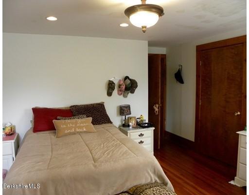 335 Federal Street Greenfield, MA 01301 - Photo 19 of 30 a bedroom with a bed and cabinets