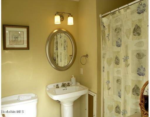 335 Federal Street Greenfield, MA 01301 - Photo 25 of 30 a bathroom with a sink and a mirror