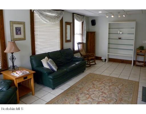 335 Federal Street Greenfield, MA 01301 - Photo 4 of 30 a living room with furniture and a window