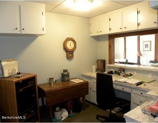335 Federal Street Greenfield, MA 01301 - Photo 7 of 30 a view of a workspace with furniture and a window
