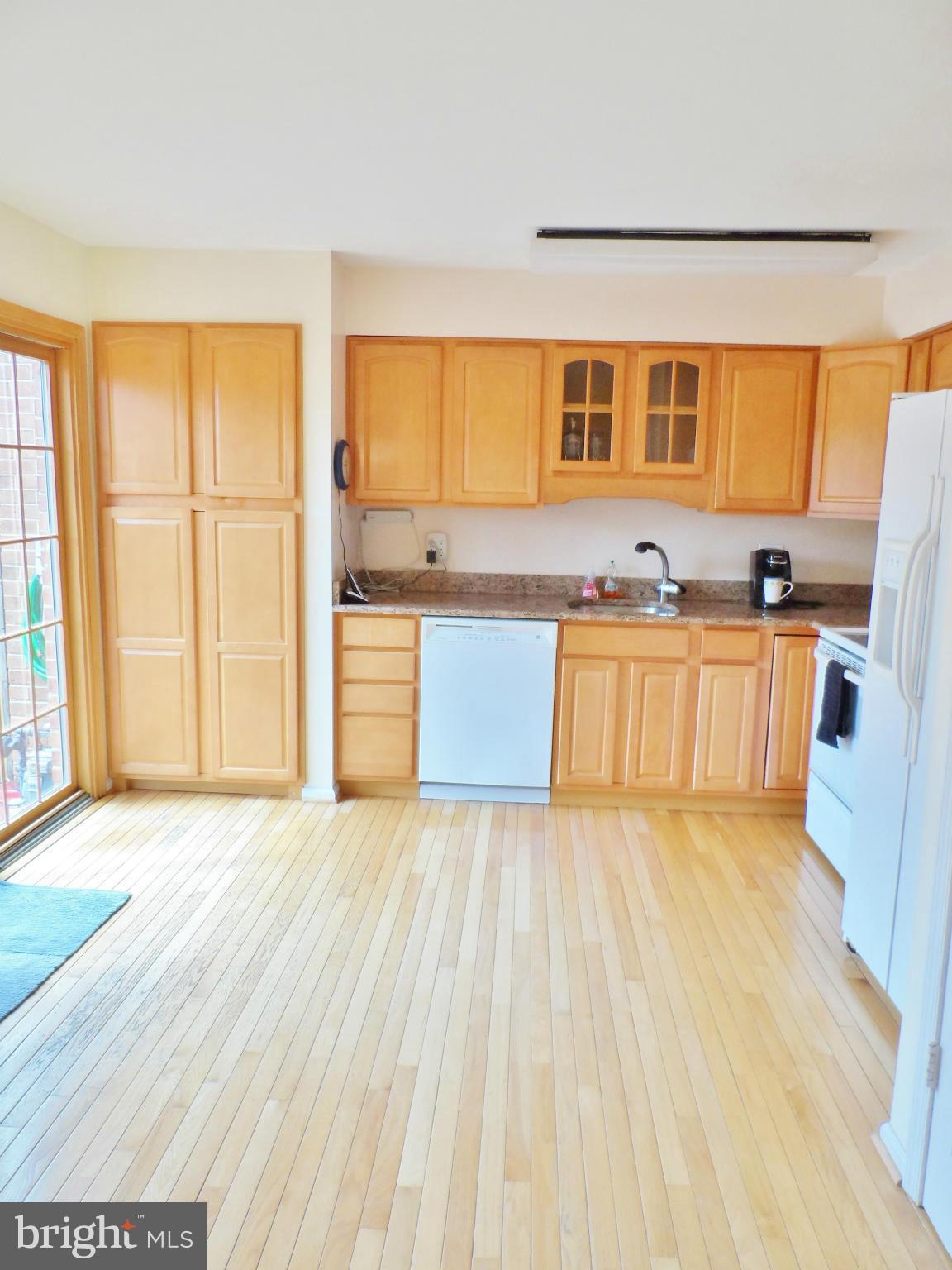 8323 Forrester Boulevard Springfield, VA 22152 - Photo 8 of 30 Bright Kitchen with Large Door to Patio!