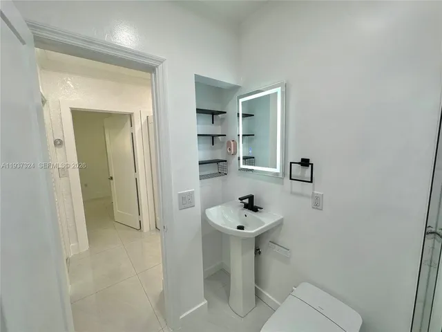 a bathroom with a sink and a toilet