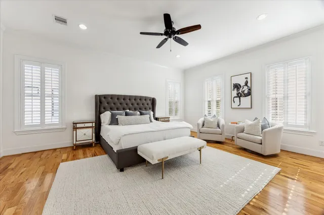 a bedroom with a bed couch and window