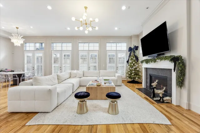 a living room with fireplace furniture and a flat screen tv