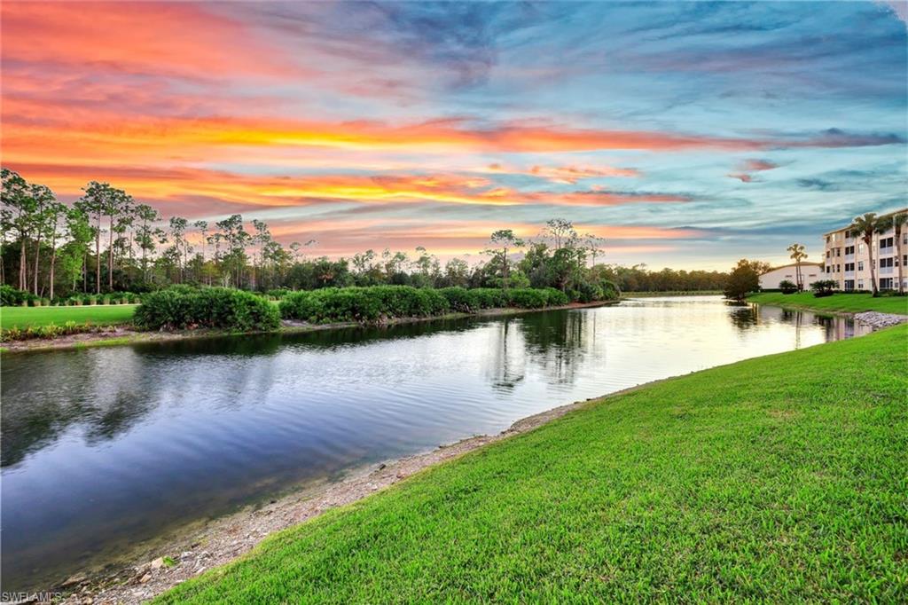a view of a lake with houses in the back
