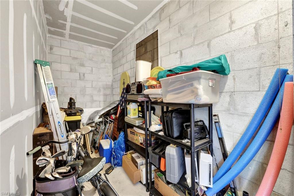 8680 Cedar Hammock Circle, Unit 142 Naples, FL 34112 - Photo 24 of 27 a view of an chairs and table in a balcony