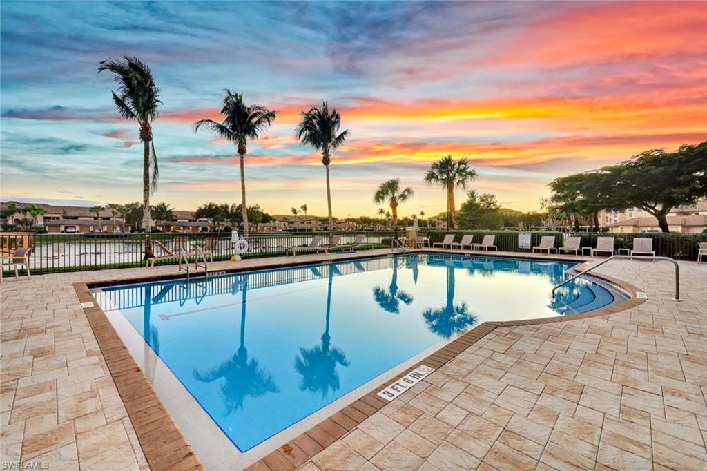 8680 Cedar Hammock Circle, Unit 142 Naples, FL 34112 - Photo 25 of 27 a view of a lake with a city view