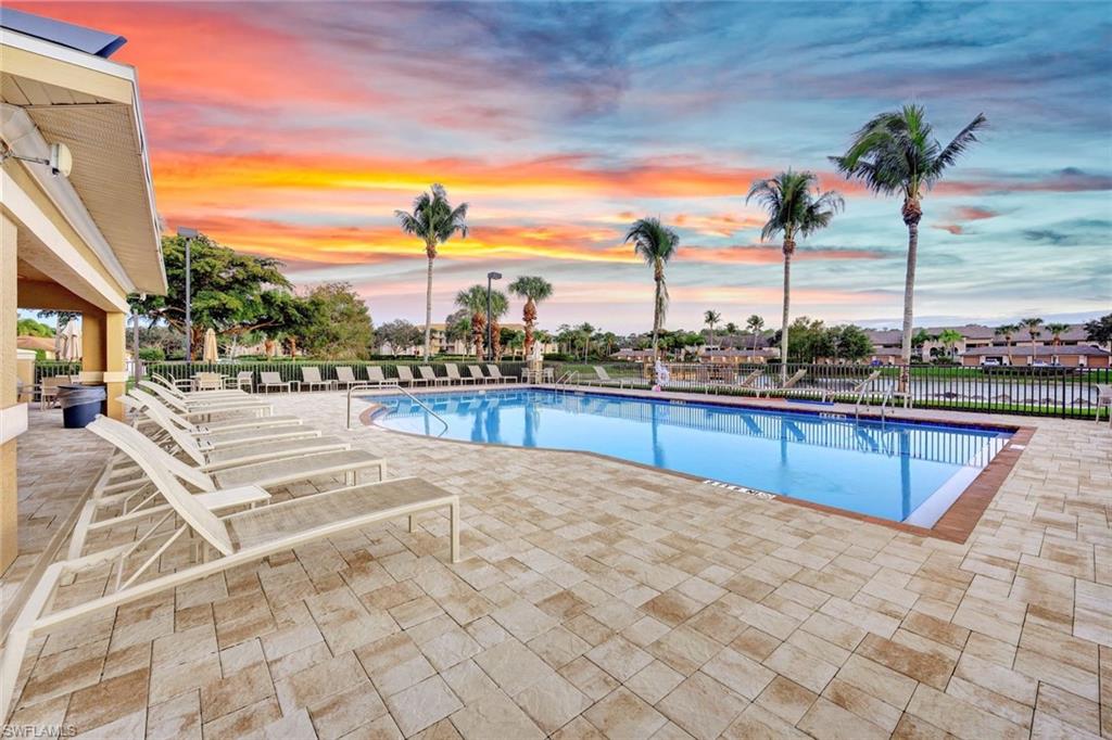 8680 Cedar Hammock Circle, Unit 142 Naples, FL 34112 - Photo 26 of 27 a view of a terrace with wooden floor and seating space
