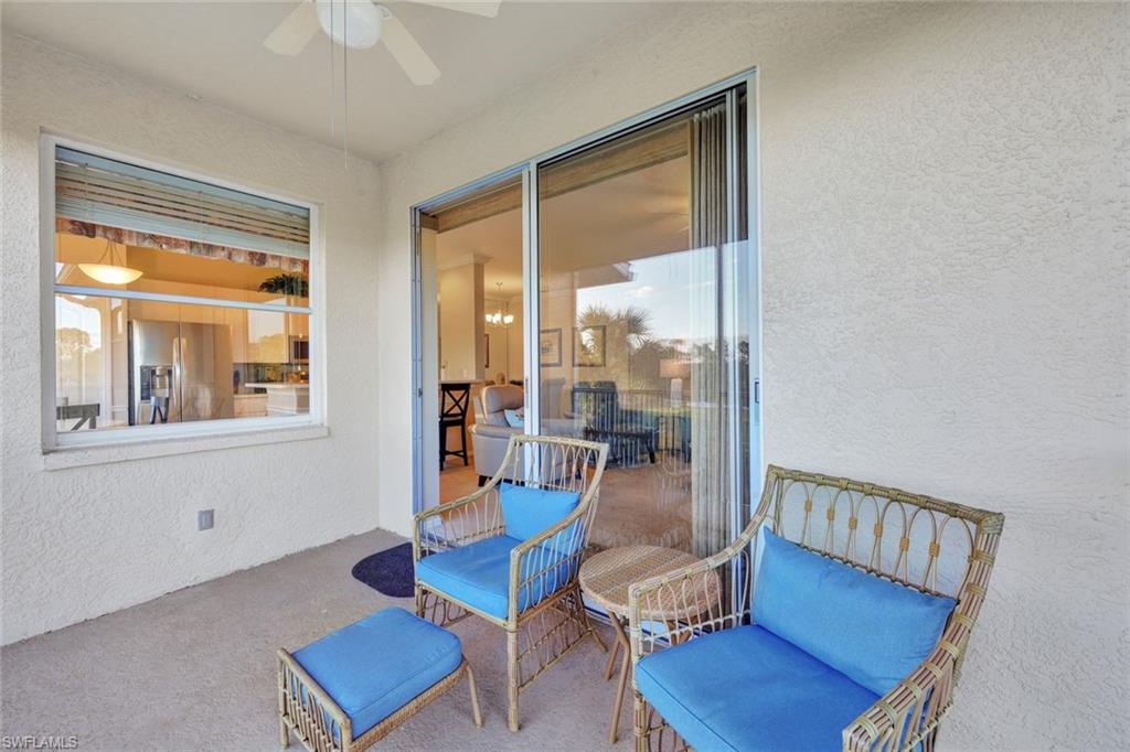 8680 Cedar Hammock Circle, Unit 142 Naples, FL 34112 - Photo 4 of 27 a living room with furniture and a window
