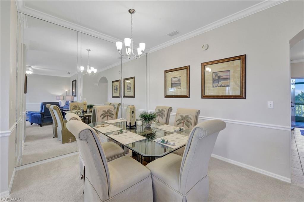 8680 Cedar Hammock Circle, Unit 142 Naples, FL 34112 - Photo 9 of 27 a view of a dining room with furniture