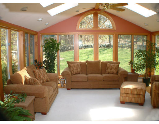 135 Raleigh Tavern Lane North Andover, MA 01845 - Photo 12 of 21 a living room with furniture and a large window