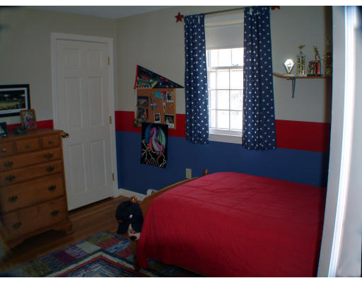 135 Raleigh Tavern Lane North Andover, MA 01845 - Photo 16 of 21 a bedroom with a bed and a window