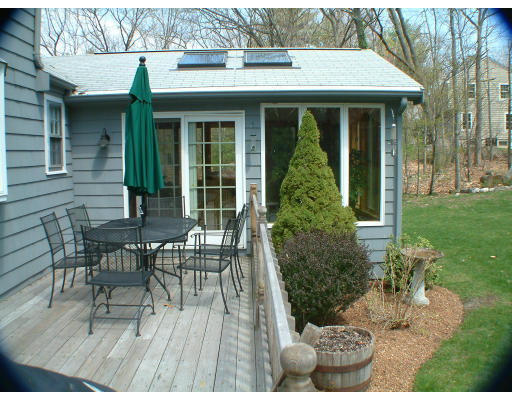 135 Raleigh Tavern Lane North Andover, MA 01845 - Photo 19 of 21 a view of a patio with table and chairs and potted plants