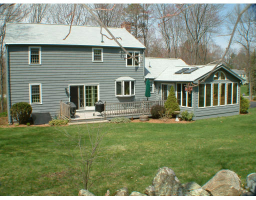 135 Raleigh Tavern Lane North Andover, MA 01845 - Photo 3 of 21 a front view of a house with a yard