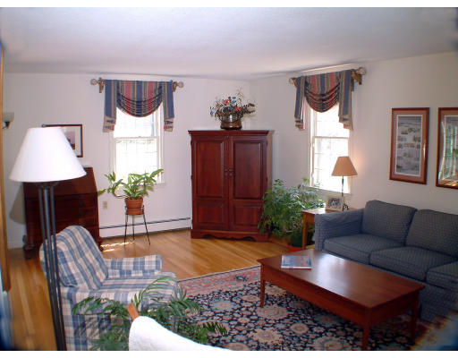 135 Raleigh Tavern Lane North Andover, MA 01845 - Photo 5 of 21 a living room with furniture rug and window