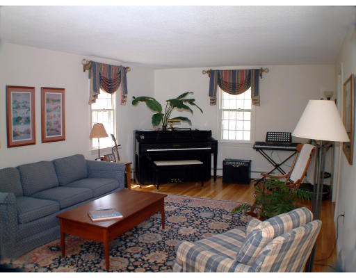 135 Raleigh Tavern Lane North Andover, MA 01845 - Photo 6 of 21 a living room with furniture and a potted plant