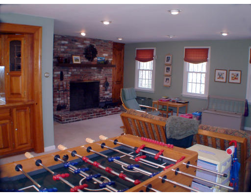 135 Raleigh Tavern Lane North Andover, MA 01845 - Photo 8 of 21 a living room with furniture fireplace and window