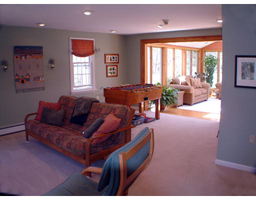 135 Raleigh Tavern Lane North Andover, MA 01845 - Photo 9 of 21 a living room with furniture and a large window