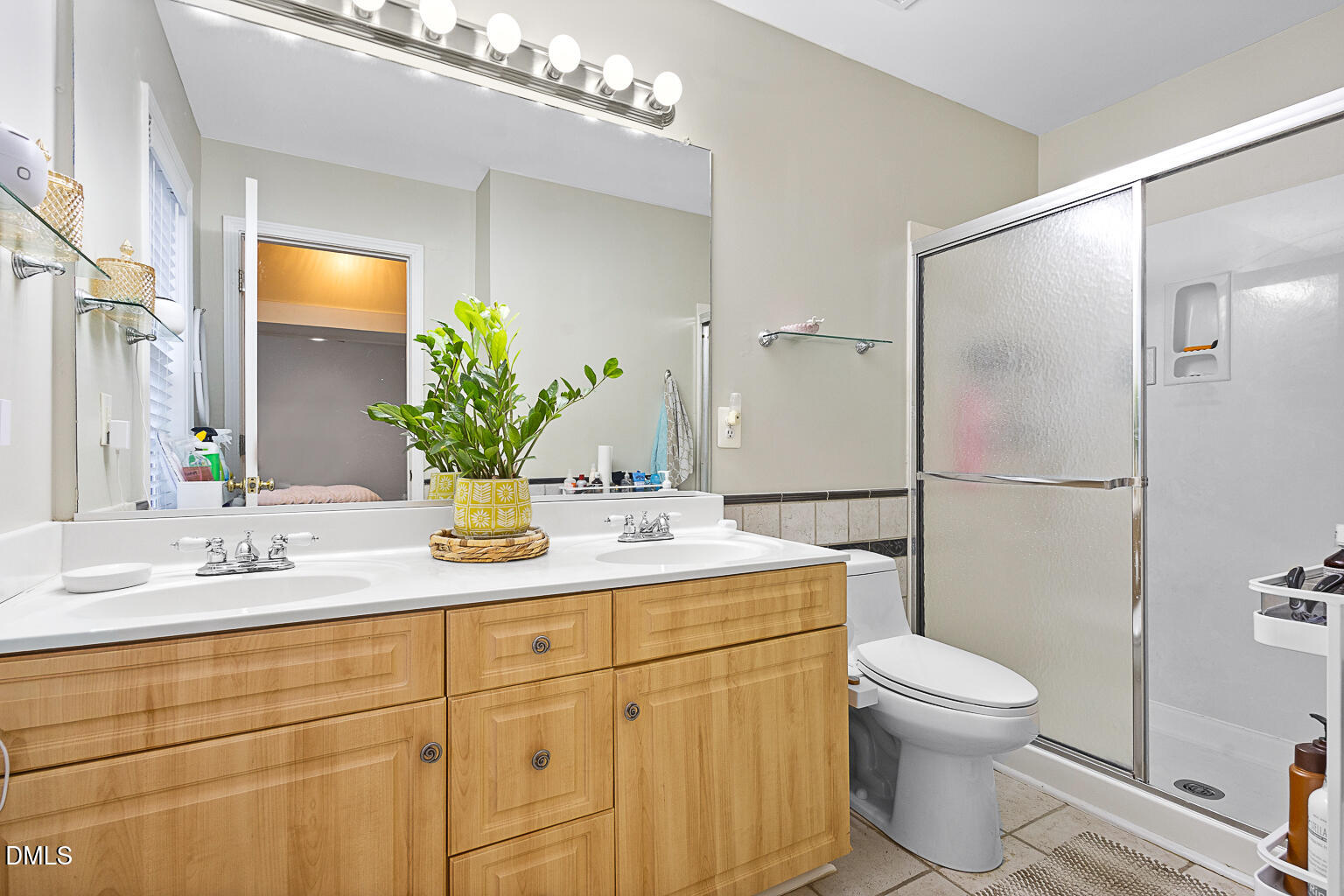 2907 Andover Glen Road Raleigh, NC 27604 - Photo 22 of 39 a bathroom with a sink a toilet and shower