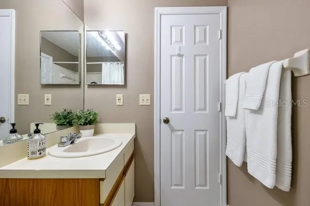 a view of empty room with a large window