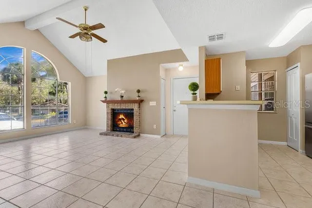 a kitchen with a stove a sink and a refrigerator