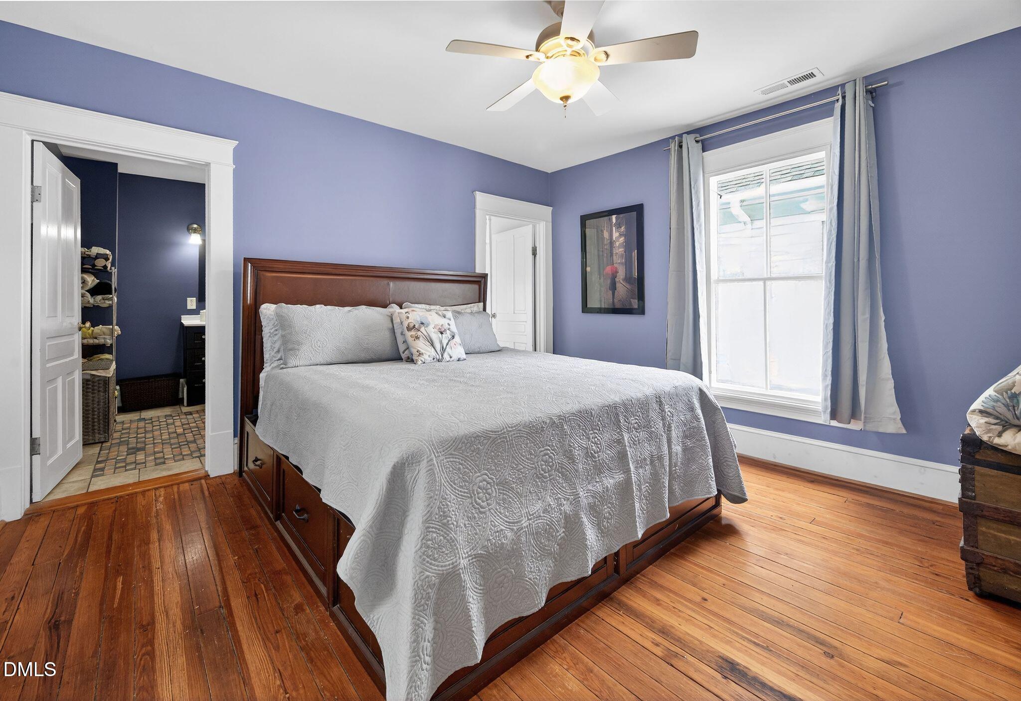 218 Pace Street Raleigh, NC 27604 - Photo 22 of 43 a bedroom with a bed and wooden floor